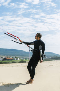Man windsurfing at beach