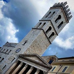 Low angle view of church against cloudy sky