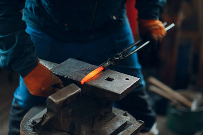 Cropped image of man working at workshop