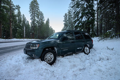 Car on snow covered land