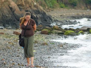 Woman standing on rocks