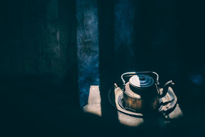 High angle view of old teapot in room