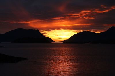 Scenic view of sea against romantic sky at sunset