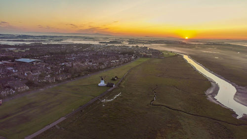 High angle view of sea against sky during sunset