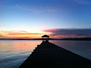 View of pier at sunset