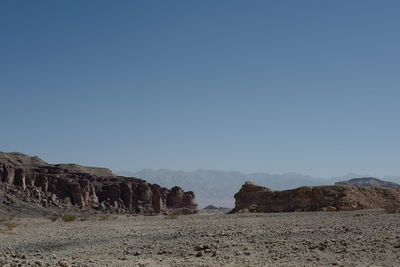 Scenic view of mountains against clear blue sky