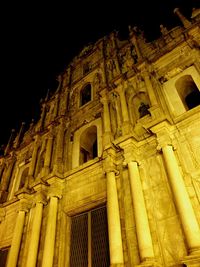 Low angle view of illuminated building at night