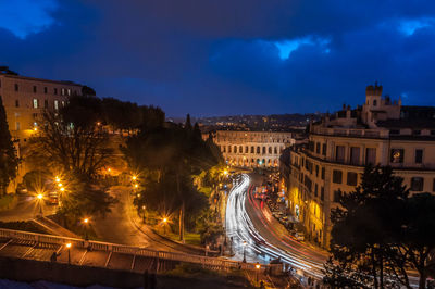 High angle view of light trails in city at night