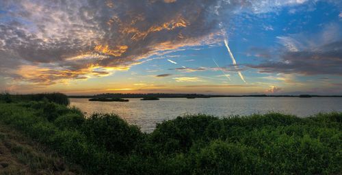 Scenic view of sea against sky during sunset