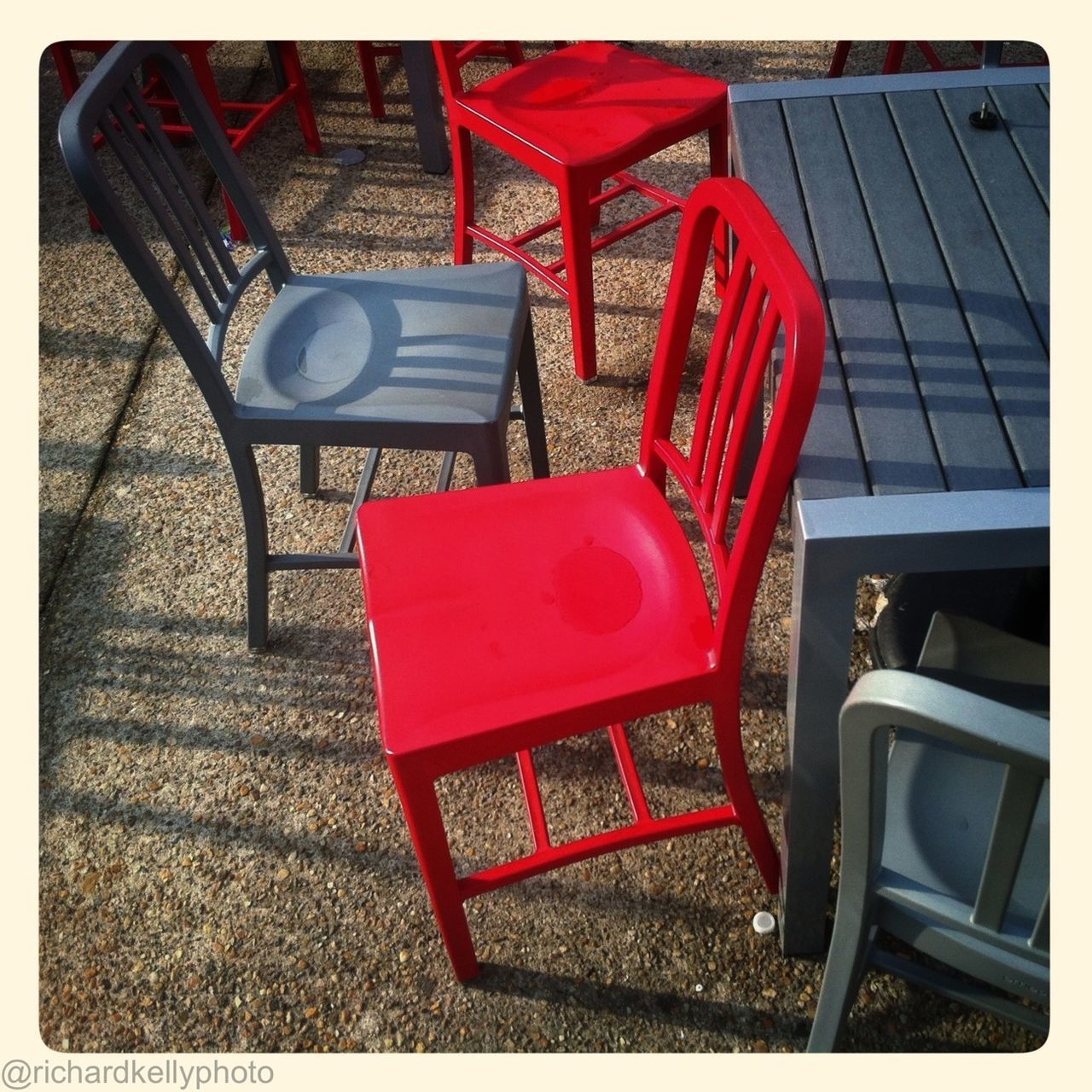 transfer print, auto post production filter, chair, red, absence, empty, seat, indoors, table, no people, day, furniture, high angle view, still life, relaxation, bench, sunlight, close-up, armchair