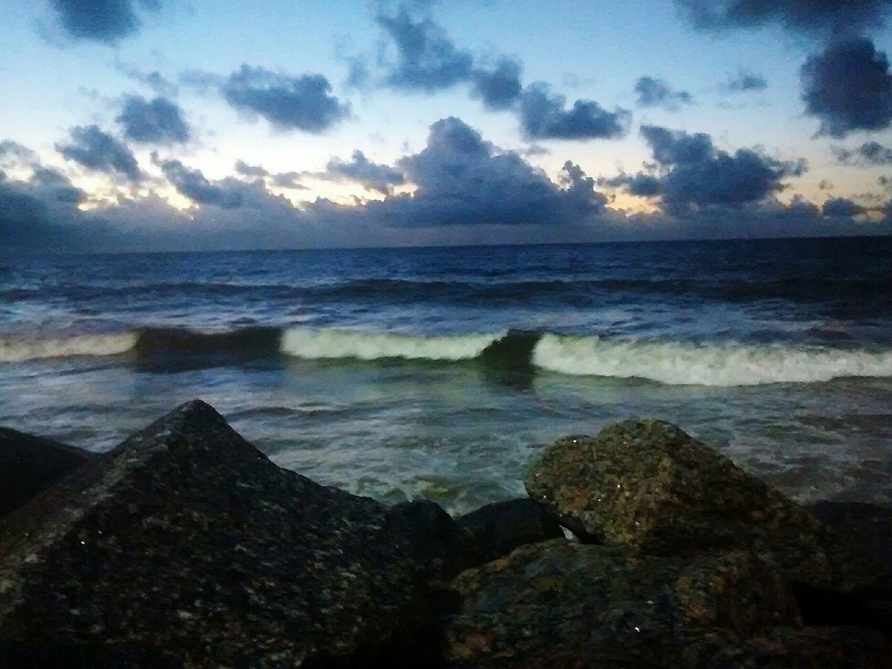 sea, water, horizon over water, sky, scenics, cloud - sky, beach, tranquil scene, beauty in nature, rock - object, shore, tranquility, nature, wave, cloudy, idyllic, cloud, sunset, surf, outdoors