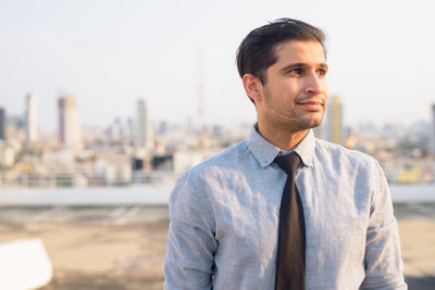 Portrait of young man looking away