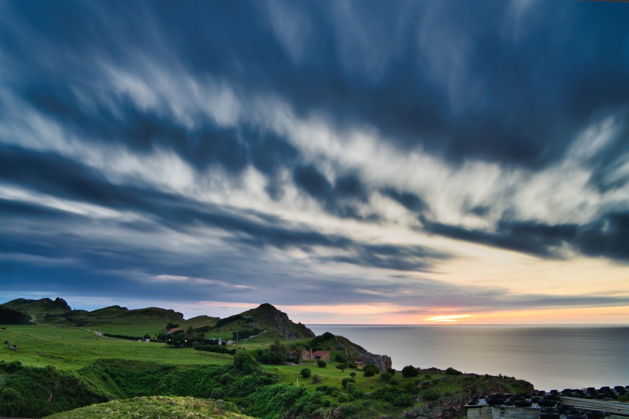 sky, cloud - sky, beauty in nature, scenics - nature, sunset, nature, architecture, building exterior, water, tranquil scene, built structure, sea, no people, tranquility, plant, building, idyllic, tree, outdoors