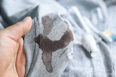 Close-up of person holding hand