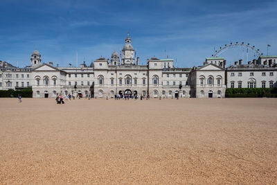 Group of people in front of historical building