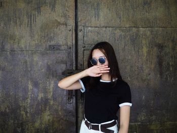 Young woman photographing outdoors