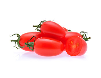 Close-up of tomatoes against white background