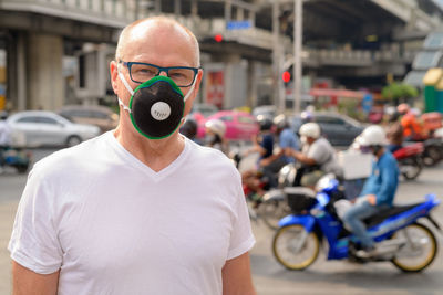 Portrait of man wearing mask on street