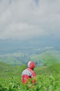 A man on field against sky