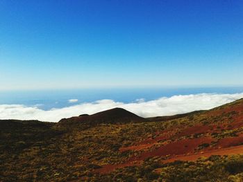 Scenic view of landscape against blue sky