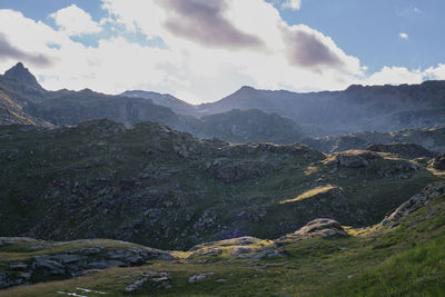 Scenic view of landscape and mountains against sky