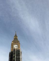 Low angle view of clock tower against sky