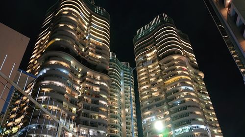 Low angle view of illuminated buildings at night