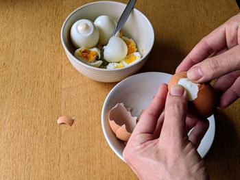 High angle view of person preparing food on table