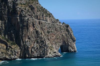 Scenic view of sea against clear blue sky