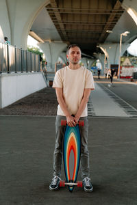 Portrait of man standing on road