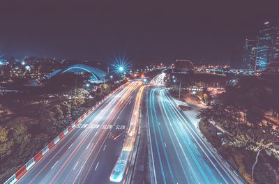 High angle view of light trails on road at night