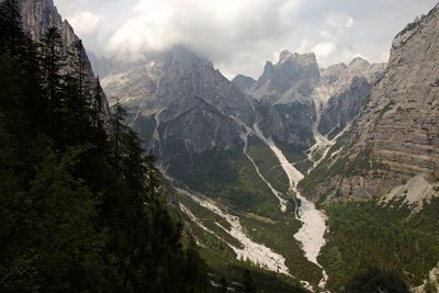 Scenic view of mountains against cloudy sky