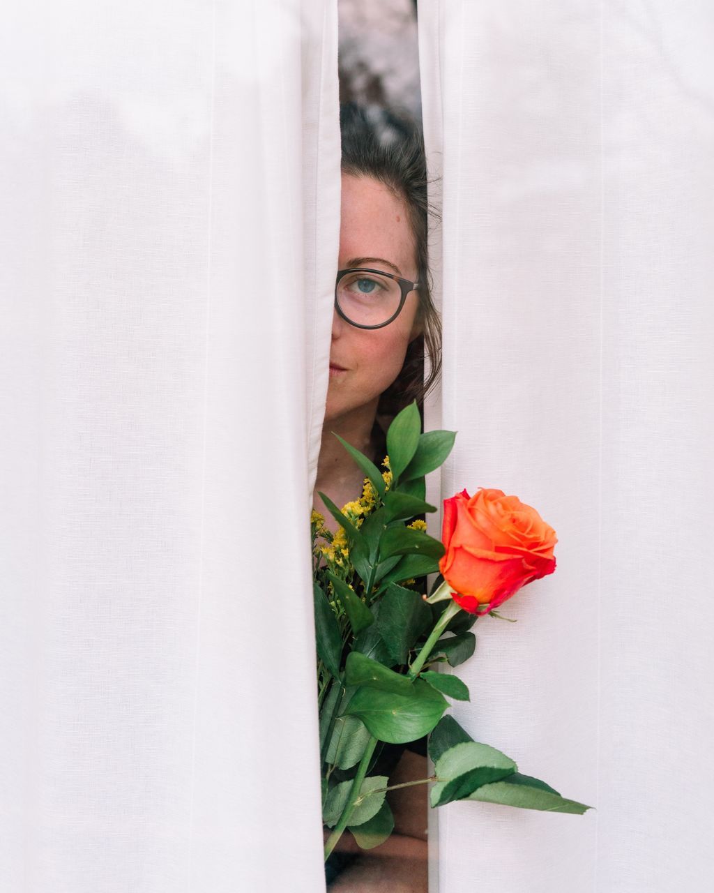 flower, one person, hiding, rose - flower, indoors, leaf, real people, fragility, lifestyles, freshness, beautiful woman, close-up, young women, young adult, white background, nature, day, flower head, people