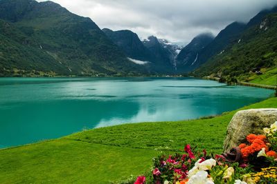 Scenic view of lake and mountains against sky