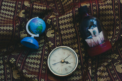 High angle view of clock on table