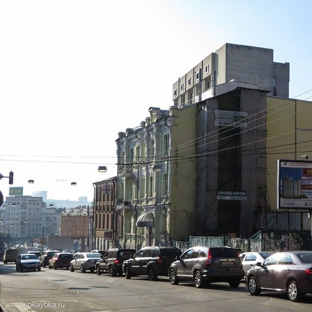 CARS IN CITY AGAINST CLEAR SKY