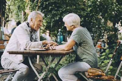 Friends sitting on table