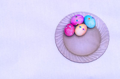 High angle view of multi colored candies in plate