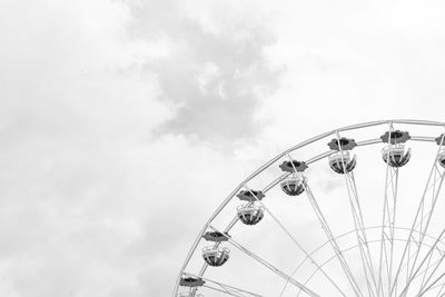 Low angle view of ferris wheel against sky