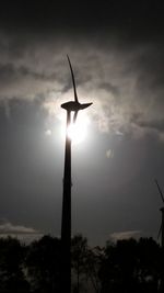 Low angle view of silhouette crane against sky during sunset