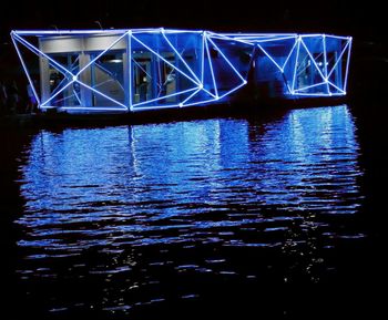 Reflection of illuminated buildings in water