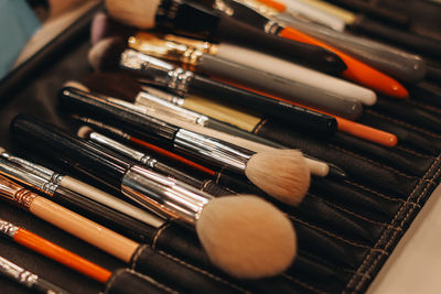 High angle view of make-up brushes on table