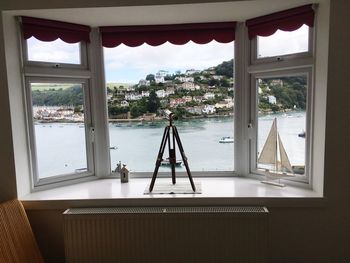 View of sea out of glass window