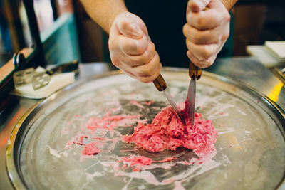 Midsection of person preparing food