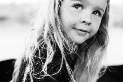 Close-up of girl with long hair looking away