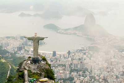 Panoramic view of statue and buildings in city