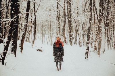 Person on snow covered field during winter
