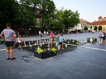 People at swimming pool in city