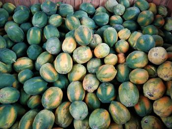 Full frame shot of papayas for sale at market stall