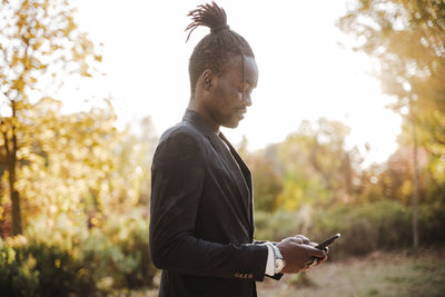 Side view of young man looking away